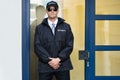 Male Security Guard Standing At The Entrance Royalty Free Stock Photo