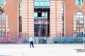 Male security guard walks around the building which it protects