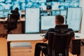 Male security operator working in a data system control room offices Technical Operator Working at workstation with Royalty Free Stock Photo