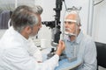 male senior in eye clinic examine eyes Royalty Free Stock Photo