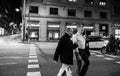 Male seniors crossing street at night in Barcelona