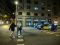 Male seniors crossing street at night in Barcelona