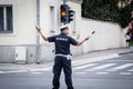 Male Serbian police officer in uniform organizing traffic and circulation in Belgrade.