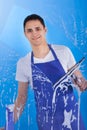 Male Servant Cleaning Glass With Squeegee Royalty Free Stock Photo