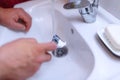 Male shaving razor blade hand, shaving beard in a bathroom Royalty Free Stock Photo