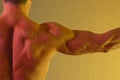 Male shoulder muscle yellow Royalty Free Stock Photo