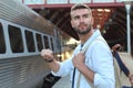 Male showing impatience at the train station Royalty Free Stock Photo