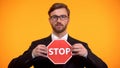 Male showing stop sign, rejecting discrimination, employees rights protection Royalty Free Stock Photo