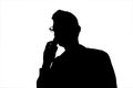 Male silhouette in glasses speaks by phone isolated