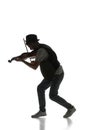 Male silhouette, musician playing violin isolated on white background. Black and white image.