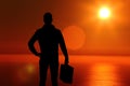 Male silhouette at sunset suitcase Royalty Free Stock Photo