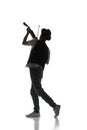 Male silhouette, talented young musician playing violin isolated on white background. Black and white image. Royalty Free Stock Photo