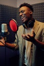 Male singer sings a song, recording studio Royalty Free Stock Photo