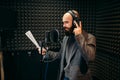 Male singer songs in audio recording studio Royalty Free Stock Photo