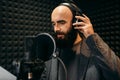 Male singer songs in audio recording studio Royalty Free Stock Photo