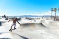 Male skateboarder shreds at the beach.