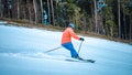 Male skier going down a slope