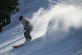 Male skier going downhill on a high speed leaving fresh powder snow behind. Active lifestyle and sport concept. Royalty Free Stock Photo