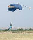 Male skydiver coming in for fast landing on grass Landing Seri