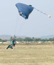 Male skydiver coming in for fast landing on grass Landing Seri