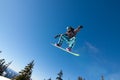 Male Snowboarder Catches Big Air. Royalty Free Stock Photo