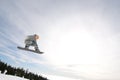 Male Snowboarder Catches Big Air. Royalty Free Stock Photo