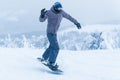 Male snowboarding snowboard jump. go in the mountains on Snow Mountain winter snowboarding Royalty Free Stock Photo