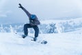 Male snowboarding snowboard jump. go in the mountains on Snow Mountain winter snowboarding