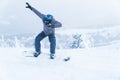 Male snowboarding snowboard jump. go in the mountains on Snow Mountain winter snowboarding