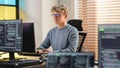 Male Software Engineer Coding On Desktop Computer in Creative Office Space. Young Caucasian Man Royalty Free Stock Photo