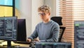 Male Software Engineer Coding On Desktop Computer in Creative Office Space. Young Caucasian Man Royalty Free Stock Photo