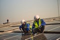 Male solar panel installation engineer fixed the solar panel on the roof Royalty Free Stock Photo