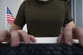 male soldier in a military uniform is sitting at a computer. center for special military psychological operations. The concept of