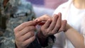 Male soldier putting engagement ring on girlfriends finger, happy marriage Royalty Free Stock Photo