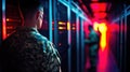 Male soldiers in camouflage uniforms inside a neon-lit data center Royalty Free Stock Photo