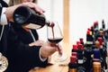 Male sommelier serving a glass of traditional red dolcetto wine Royalty Free Stock Photo