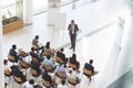 Male speaker with digital tablet speaks in a business seminar Royalty Free Stock Photo