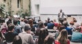 Man giving presentation in lecture hall at university. Royalty Free Stock Photo