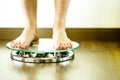 Male on standing on glass floor weight scales, close up Royalty Free Stock Photo