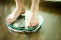 Male on standing on glass floor weight scales, close up Royalty Free Stock Photo