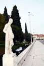 Male statue, street, river, trees and street in Castelfranco Veneto, in Italy Royalty Free Stock Photo