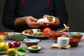 Male street vendor hands making taco. Mexican cuisine snacks, cooking fast food for commercial kitchen