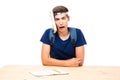 Male student with book strapped to his head