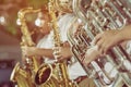 Male student with friends blow the euphonium with the band for performance on stage Royalty Free Stock Photo