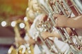 Male student with friends blow the euphonium with the band for performance on stage Royalty Free Stock Photo