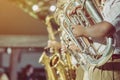 Male student with friends blow the euphonium with the band for performance on stage Royalty Free Stock Photo