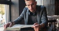 Male student hipster reading a book. Knowledge, education, development concept. Horizontal image Royalty Free Stock Photo