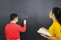 Male student learns math with his female teacher Royalty Free Stock Photo