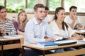 Male student listening a lecture in classroom Royalty Free Stock Photo