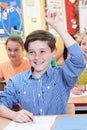 Male Student Raising Hand To Answer Question On Class Royalty Free Stock Photo